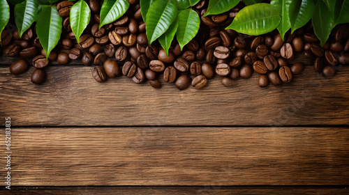 Coffee beans in a brown wooden background and with coffee leaves in the form of damaged and weathered surfaces use of general materials.