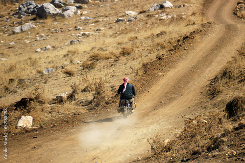 Syrian Refugee on a Motorbike in Lebanon