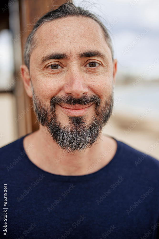 Happy man wearing blue T-shirt at beach Happy man wearing blue T-shirt at beach
