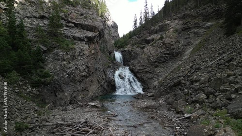 Aerial fly forward into Devils Punchbowl waterfall in Crested Butte Colorado photo