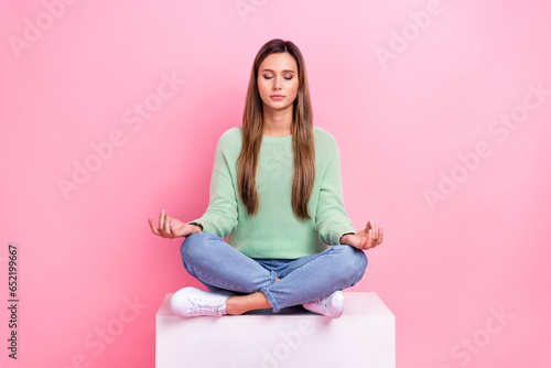 Full size body photo of charming nice woman closed eyes sitting white podium balance harmony retreat isolated on pink color background