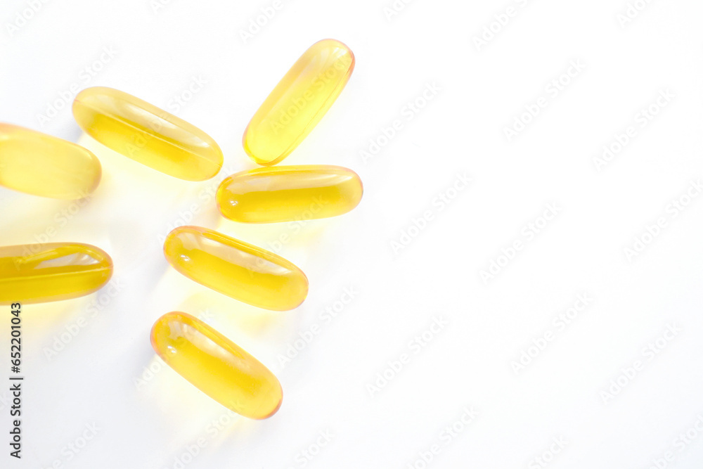 Oil pills on the table. Photo can be used for evening primrose, omega 3 and fish oil concepts. Oil pills on the table. Photo can be used for evening primrose, omega 3 and fish oil concepts.