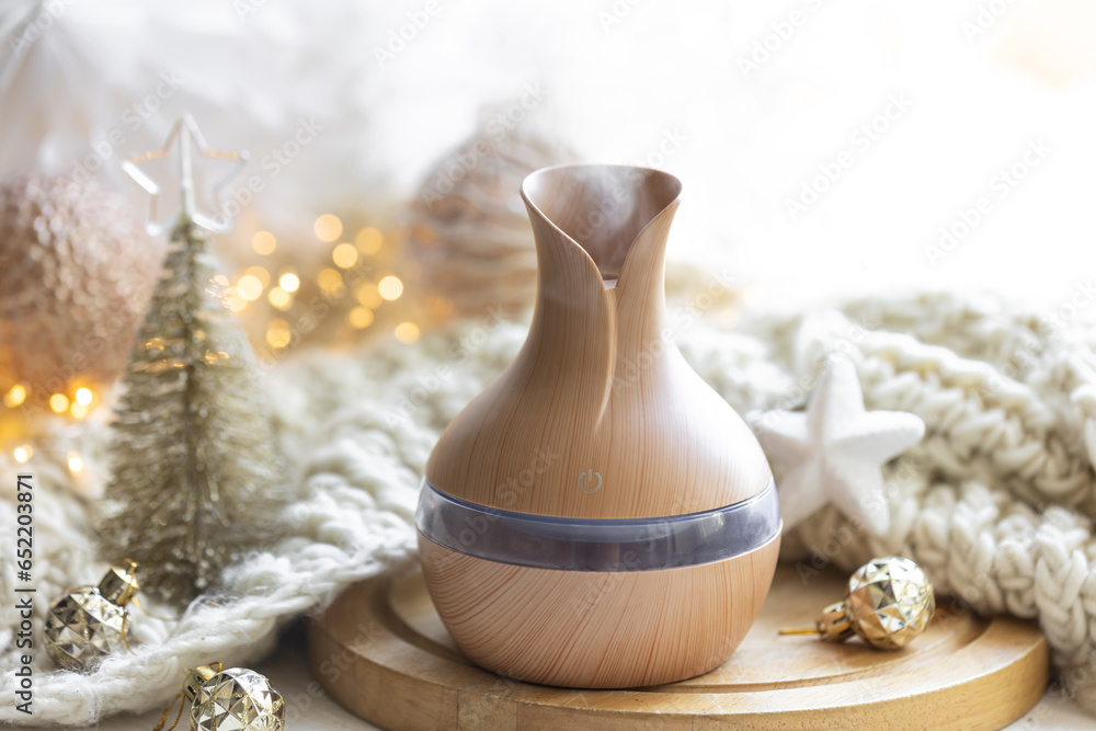 Christmas still life with an aroma diffuser for moisturizing the air. Christmas still life with an aroma diffuser for moisturizing the air.