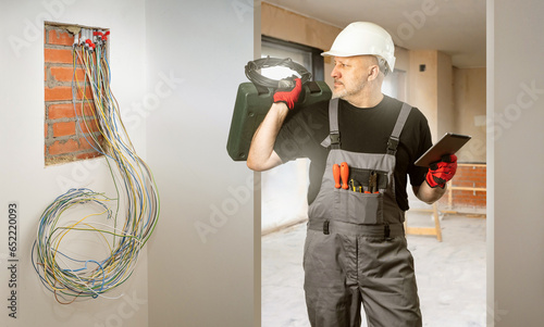 Man is electrician. Builder...