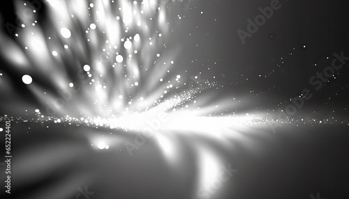 A dynamic black and white abstract composition featuring a powerful burst of light and particles, creating a magical explosion of energy with scattered bokeh.