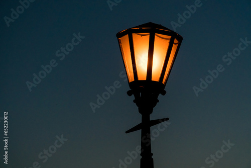 Close up view of a retro srteet lantern in the evening. photo