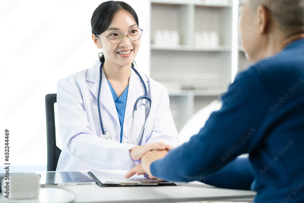 Friendly female doctor hands holding patient hand sitting at the desk for encouragement, empathy, support while medical examination. Friendly female doctor hands holding patient hand sitting at the desk for encouragement, empathy, support while medical examination.