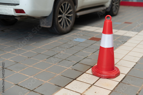 orange traffic cone on park in  supermarket