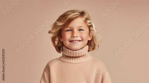 This heartwarming image shows a child's joyful expression against a beige studio background.