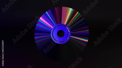 Abstract concept. CD DVD disc on a black isolated background. Neon blue purple color. Rainbow. 3D animation