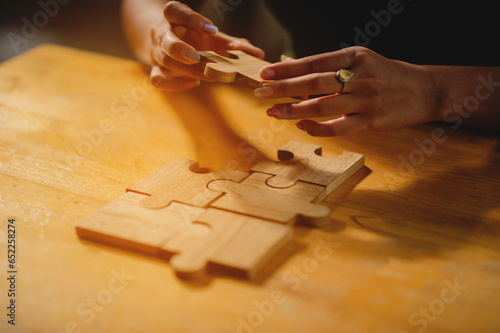 jigsaw, puzzle pieces, wooden jigsaw, unity, building blocks and teamwork Connection and communication © FOTO SALE
