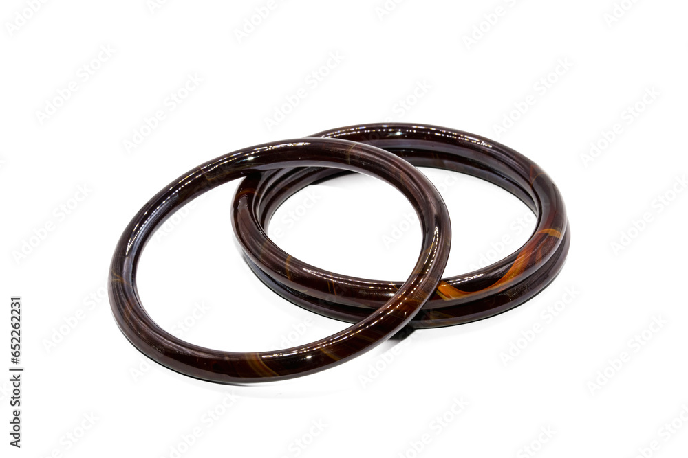 Naklejka premium old bangle bracelet has brown wooden pattern isolated on white background,macro photo,has path
