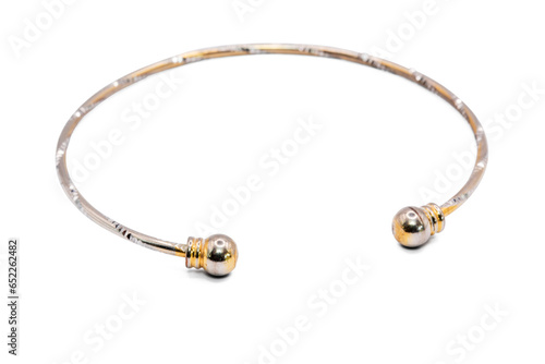 old bangle bracelet made from shiny metal isolated on white background,macro photo,has path