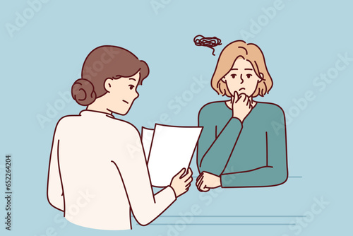Woman is interviewing in corporation and is nervous waiting for recruiter to read resume and make job offer. Worried girl needs good job and feels fear due to self-doubt or lack of skills