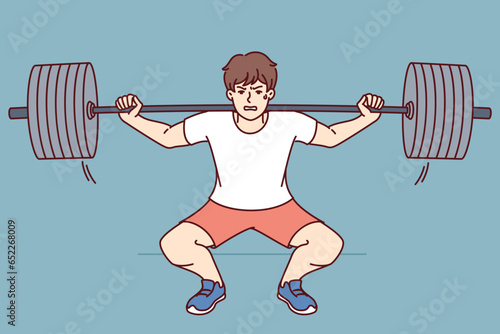 Man squats with barbell on shoulders, doing weightlifting in gym and trying to set new sports record. Guy wants to become professional bodybuilder lifts barbell to build muscle and succeed in fitness