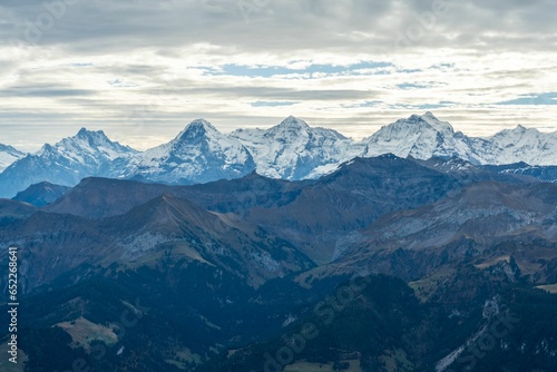Fototapeta Naklejka Na Ścianę i Meble -  Breathtaking view of the Bernese Oberland mountains in Switzerland with a dramatic cloudy sky