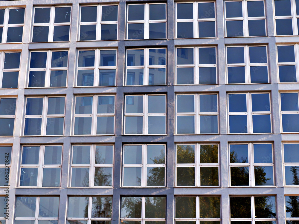 building consisting of square windows. glass facade. building consisting of square windows. glass facade.