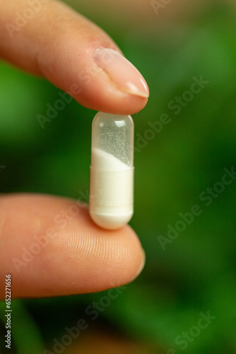 Close up of white pill, alternative treatments, drug dosage