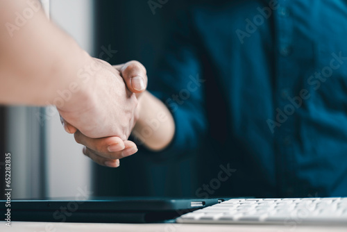 Businessmen making handshake with partner,dealing,greeting,business joint venture concept, for business, finance and investment background, teamwork and successful business.