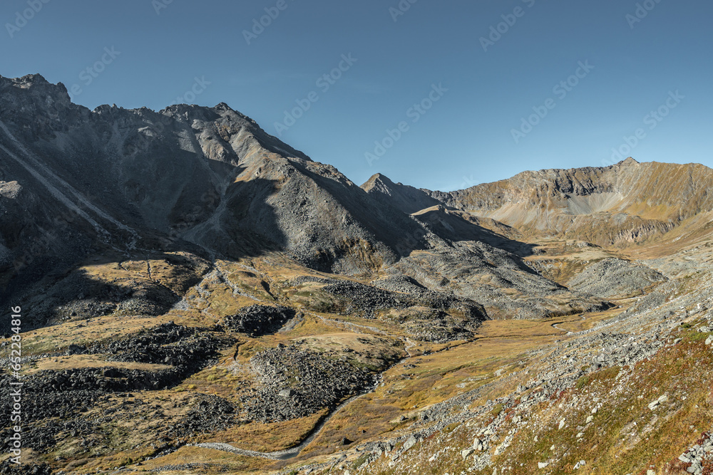 Fototapeta premium Mountain landscape with a peak and blue sky on a sunny autumn day. Eastern Sayan Mountains