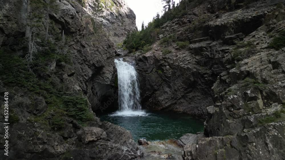 Aerial of Devils Punchbowl waterfall in Crested Butte Colorado with blue pools of water Aerial of Devils Punchbowl waterfall in Crested Butte Colorado with blue pools of water