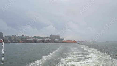 Staten Island Ferry. 4K video filmed from a ferry departing from Staten Island during a cloudy day in New York.