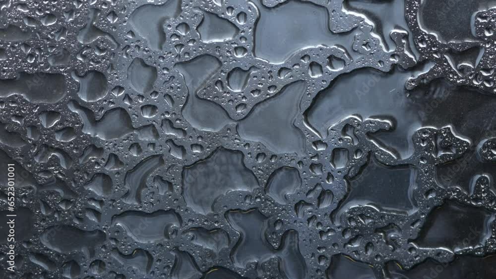 4K abstract video with the amazing textures created by water rain drops on a glass. Great for water wallpaper and background. 4K abstract video with the amazing textures created by water rain drops on a glass. Great for water wallpaper and background.