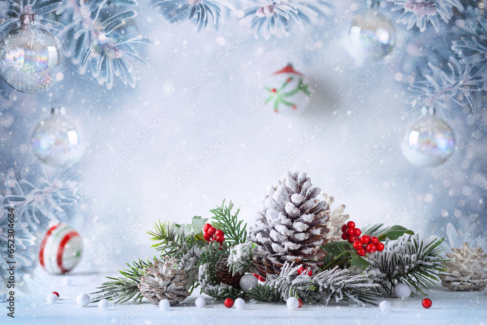 Christmas still life with snowy pine cones, baubles and fir branches on light background. Winter or Christmas festive concept. Christmas still life with snowy pine cones, baubles and fir branches on light background. Winter or Christmas festive concept.