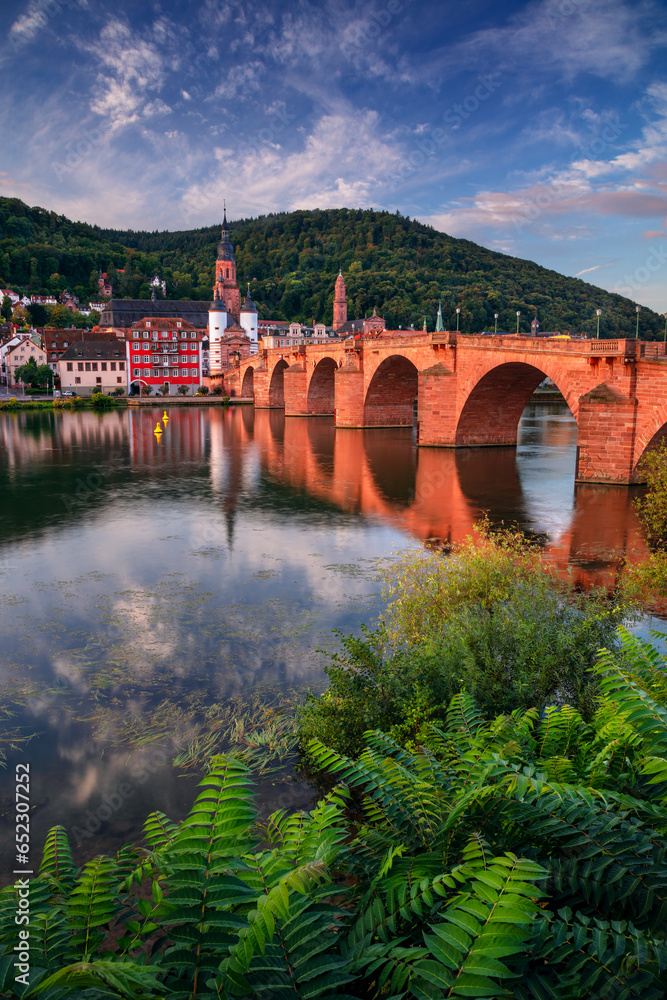 Heidelberg, Germany. Cityscape image of historical city of Heidelberg, Germany with Old Bridge Gate at autumn sunrise.