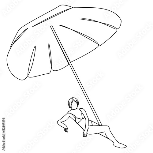 girl sunbathing under an umbrella