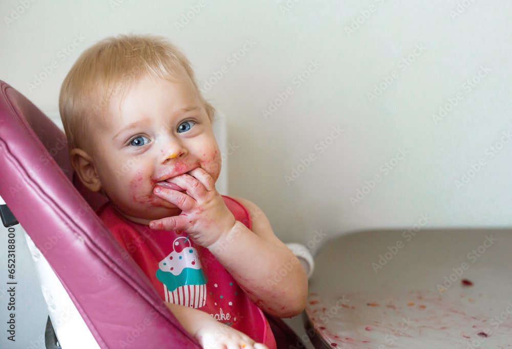 Baby food. The first meal. Feeding the baby. A cute little kid eats