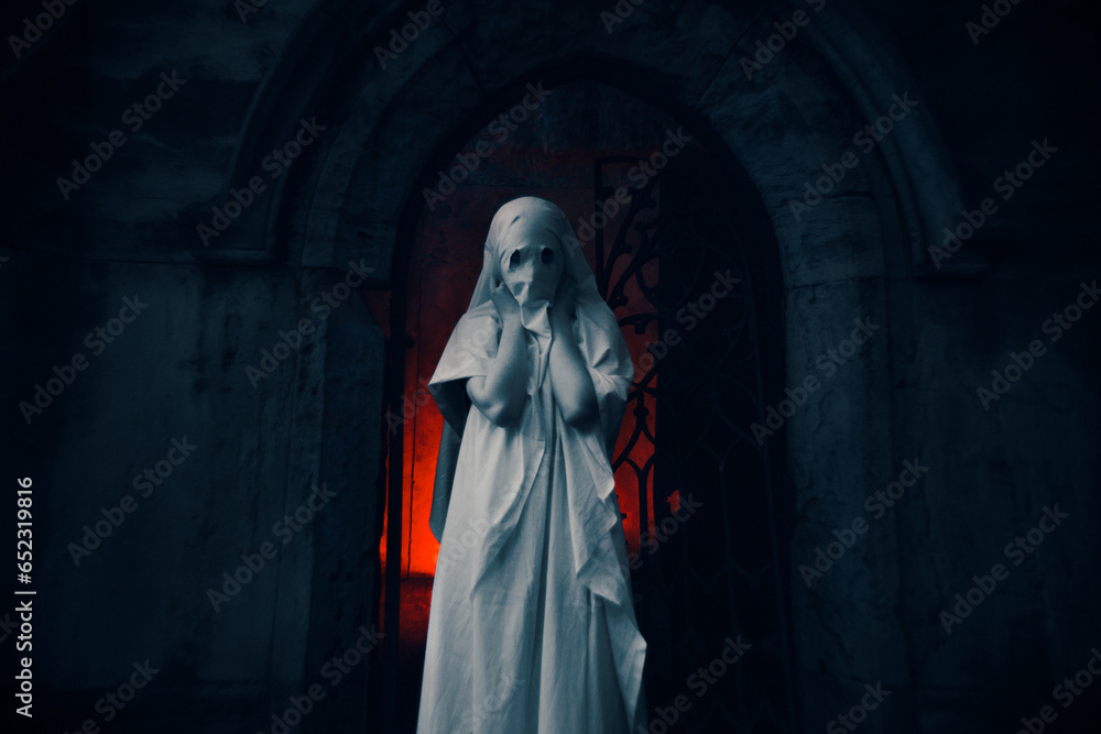 A mysterious figure standing at the entrance of an old medieval crypt shrouded in an eerie white dress, illuminated by a red glow. Mysticism and horror, Halloween. This supernatural and the unknown.