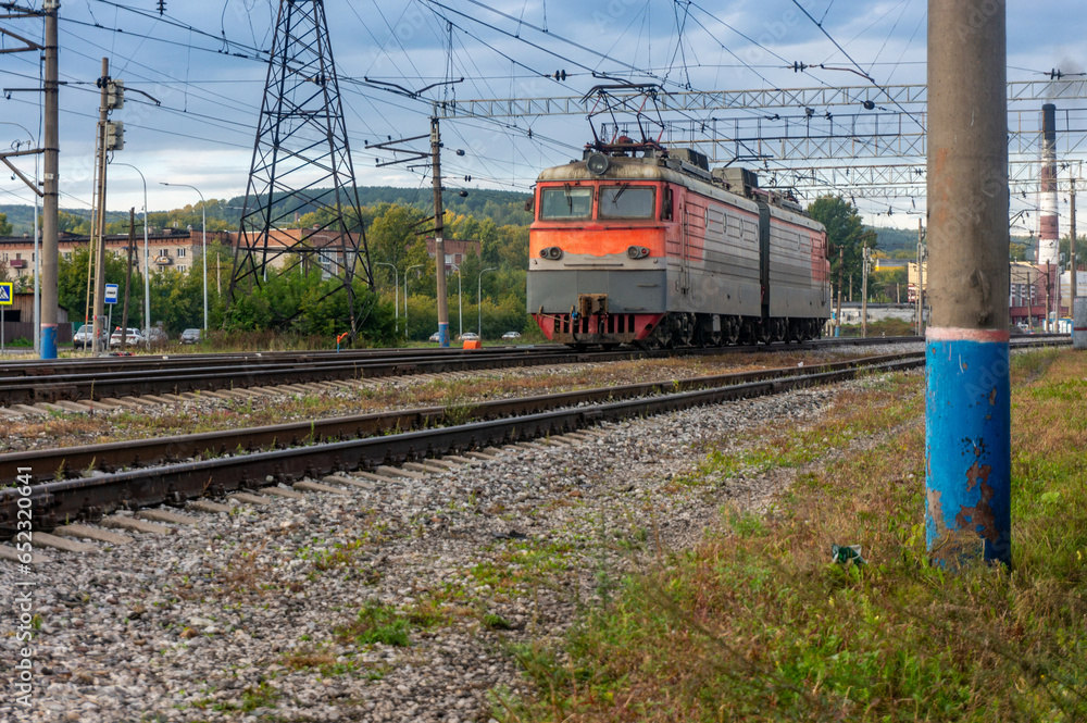 Locomotive on the railway tracks in the city. Russia. Locomotive on the railway tracks in the city. Russia.