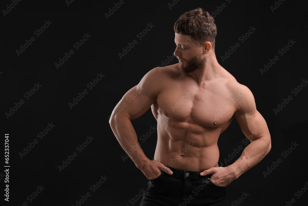 Handsome muscular man on black background, space for text. Sexy body Handsome muscular man on black background, space for text. Sexy body