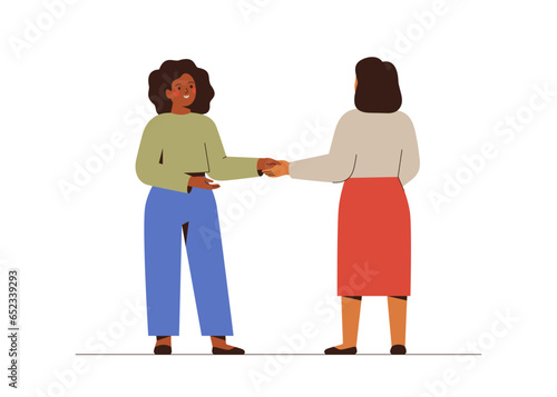 Business women respectfully shake each other's hands. Handshake between partners. Two female characters doing Greeting gesture  and hold hands.Teamwork and corporate communication. Vector illustration