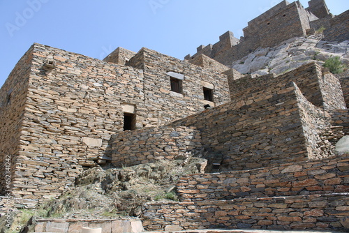 Beautiful daytime view of the historical ruins of Thee Ain (Zee Ain or Dhee Ain) Ancient Village in Al Bahah, Saudi Arabia. This place is also known as the historical Marble Village. photo