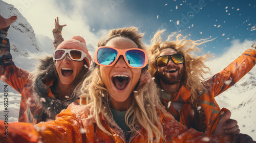 Group of tourists having fun at ski and snowboard resort. photo
