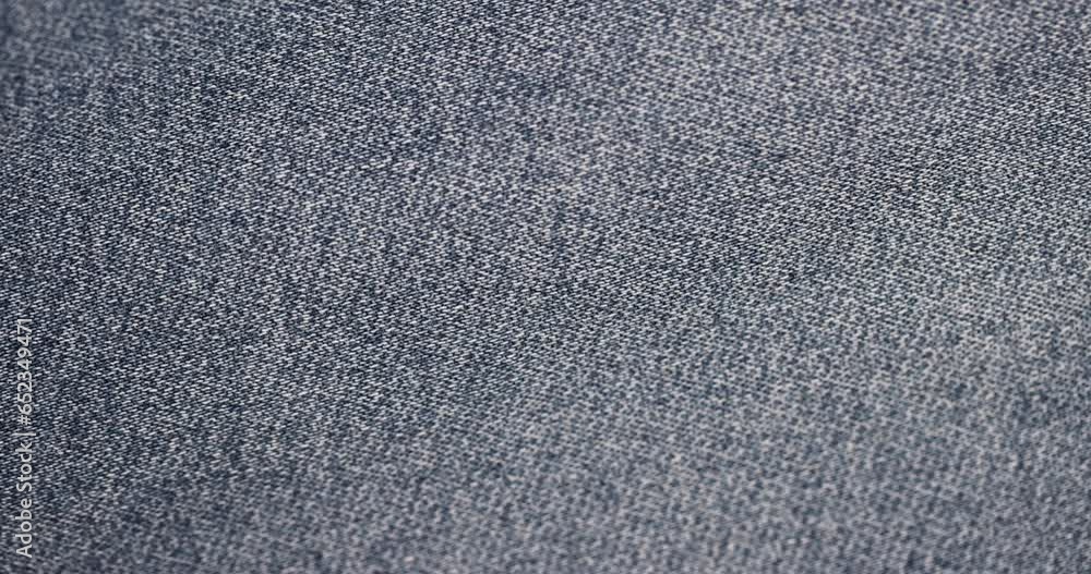 blue denim fabric made of cotton, details of a piece of clothing sewn from blue denim blue denim fabric made of cotton, details of a piece of clothing sewn from blue denim