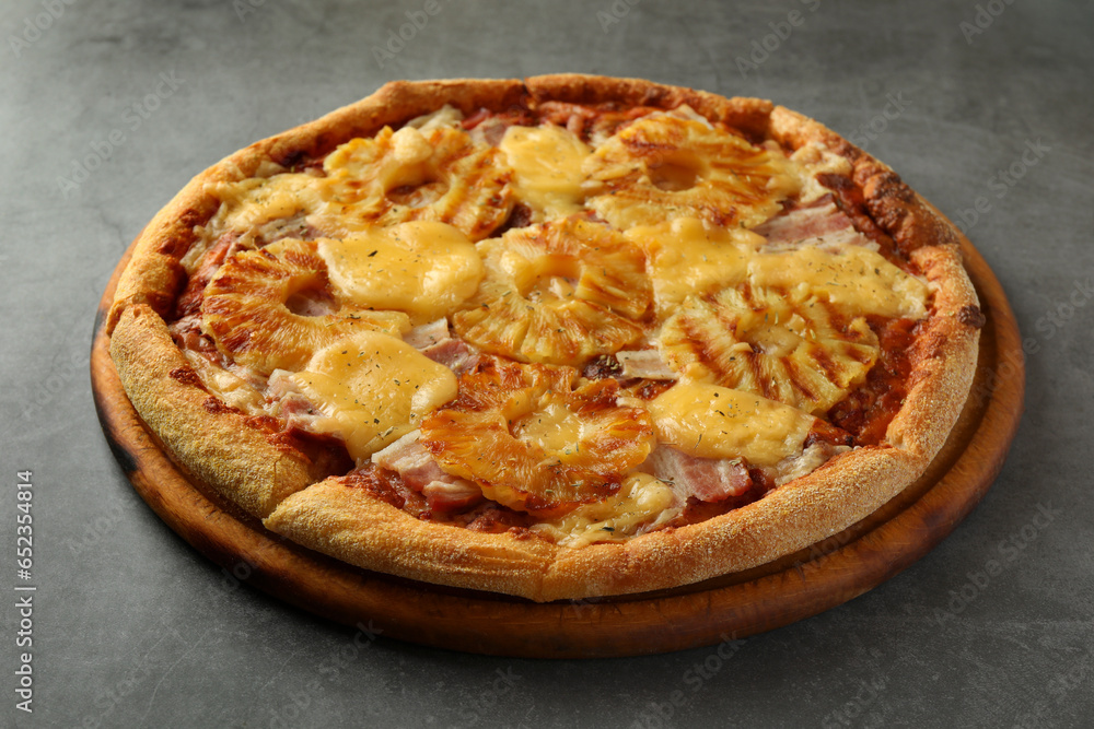 Delicious pineapple pizza on gray table, closeup