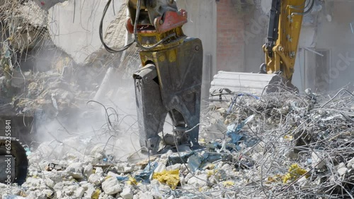 Process of dismantling the building. Equipment for engineering and construction services is in operation. Demolition of emergency buildings and removal of construction debris.
