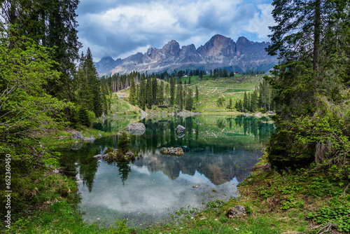 Blue lake in the Dolomites Italy, Carezza lake Lago di Carezza, Karersee with Mount Latemar, South tyrol, Italy.