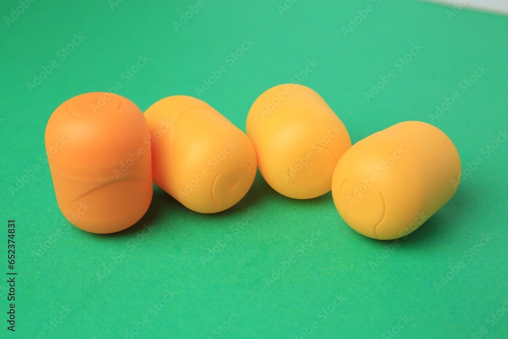 Sveti Vlas, Bulgaria - June 29, 2023: Plastic capsules from Kinder Surprise Eggs on green background Sveti Vlas, Bulgaria - June 29, 2023: Plastic capsules from Kinder Surprise Eggs on green background