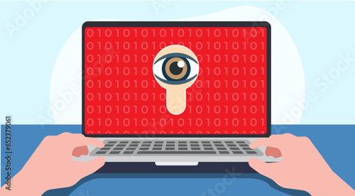 scene of a person working on a laptop with a spy eye on the screen. concept of maware, phishing, spyware, malware. 
