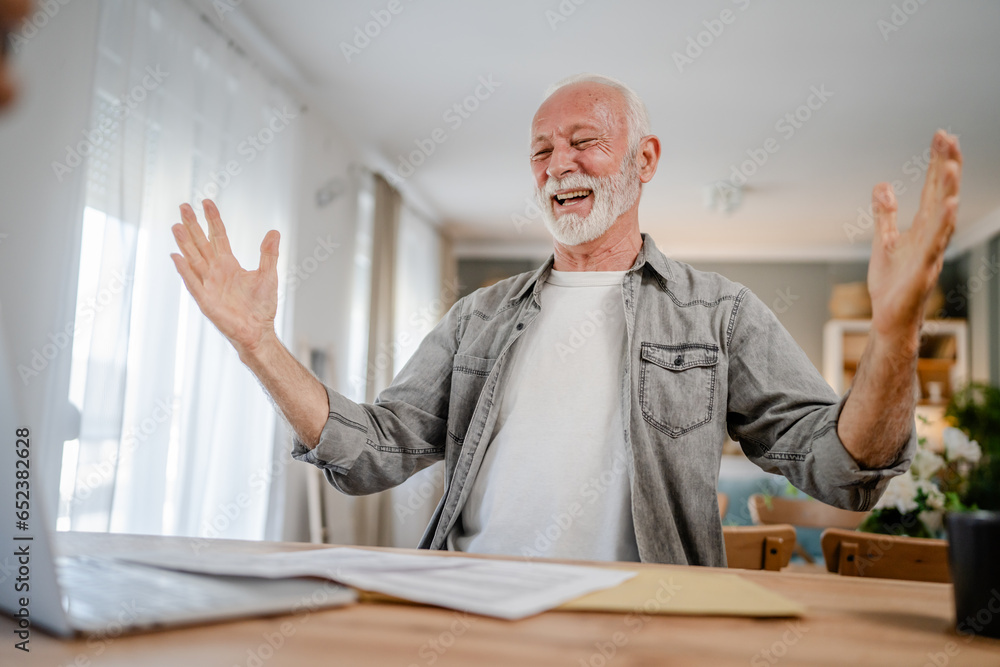 senior caucasian man open mail letter or document envelope at home senior caucasian man open mail letter or document envelope at home