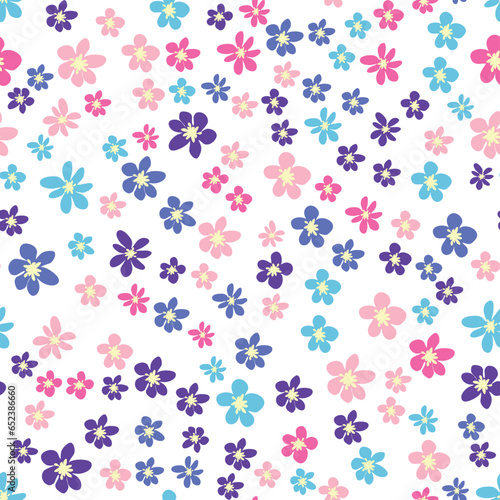 Floral seamless pattern with pink, lavender, blue, purple chamomile flower and leaves. Childish, feminine, gentle