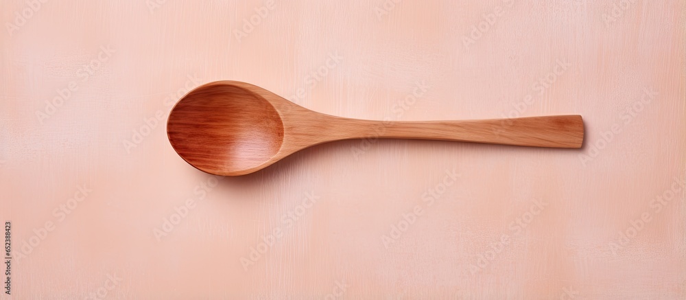 Wooden utensil on isolated pastel background Copy space Wooden utensil on isolated pastel background Copy space