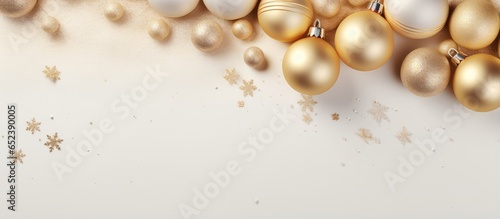 Copy space with snowy golden Christmas balls
