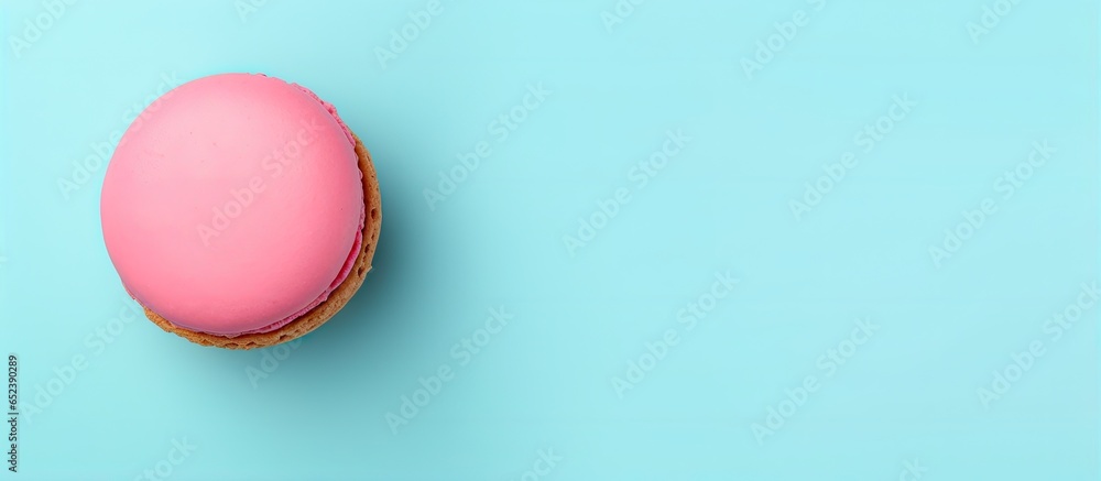 Fototapeta premium A vibrant macaroon against a isolated pastel background Copy space