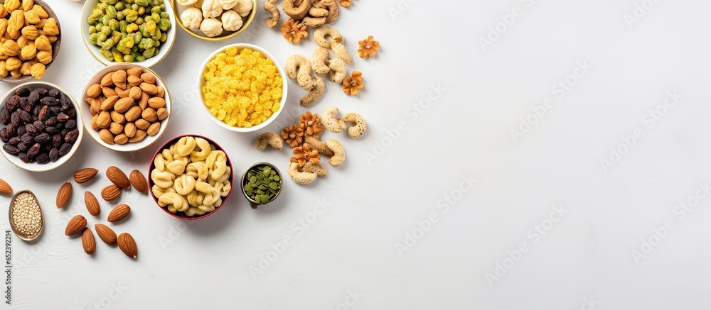 Traditional Diwali treats from India in white bowls Maharashtras favorite recipes with dry fruits isolated pastel background Copy space Traditional Diwali treats from India in white bowls Maharashtras favorite recipes with dry fruits isolated pastel background Copy space