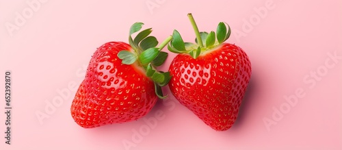Two isolated strawberries on a isolated pastel background Copy space with a fresh organic appeal